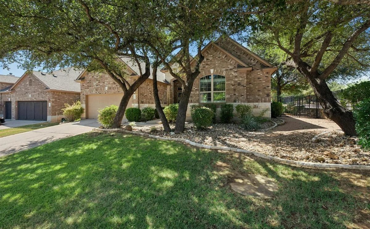 15612 Pontic Pass, Bee Cave, TX — front exterior under the oaks