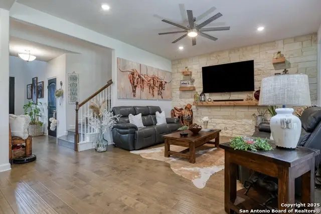 1531 Esser Xing, New Braunfels, TX — living room with stone wall
